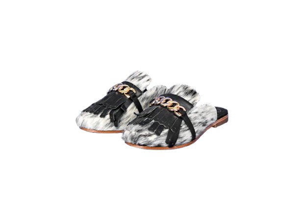Ines hair on hide fringe mule in black and white cowhide, square toe, flat sole, handcrafted in Mexico