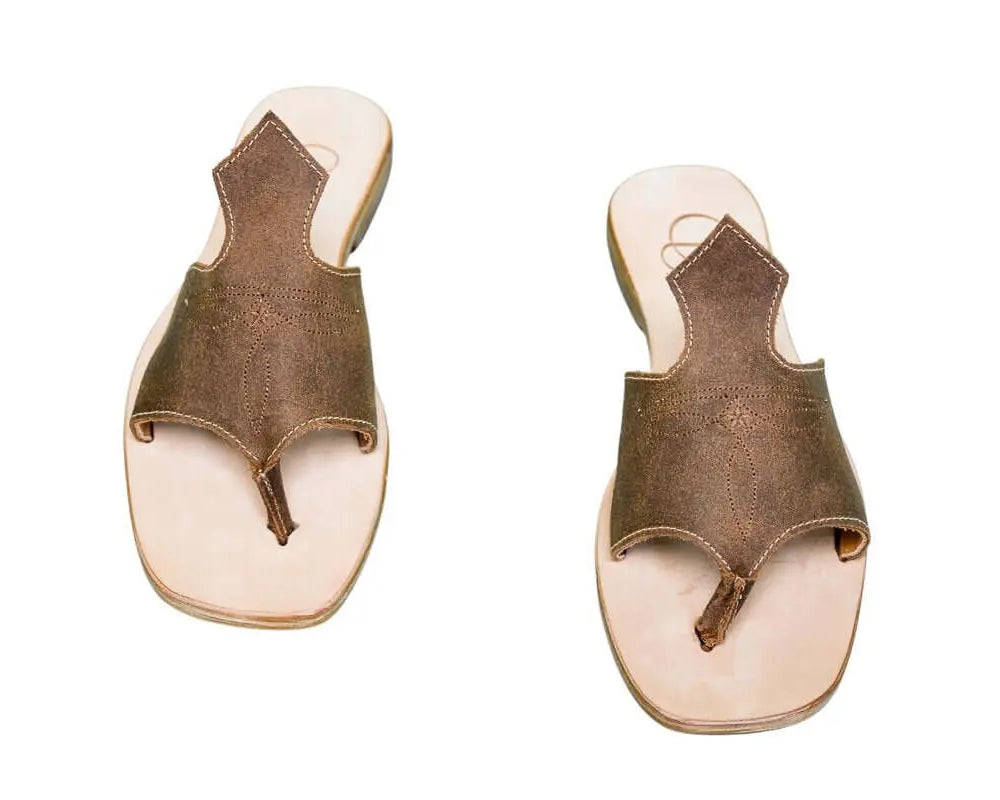 Hair-on hide and leather flip flop sandals perfect for sunny days. Western footwear
