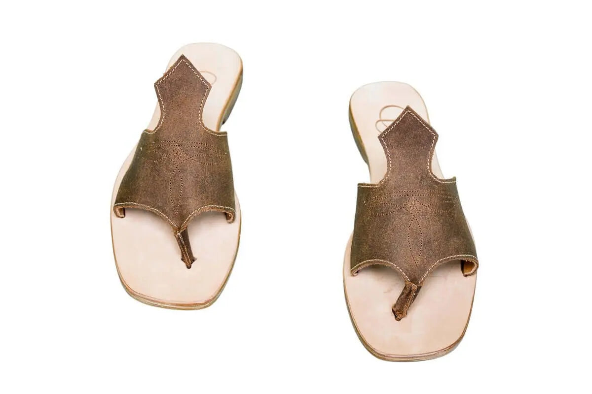 Hair-on hide and leather flip flop sandals perfect for sunny days. Western footwear