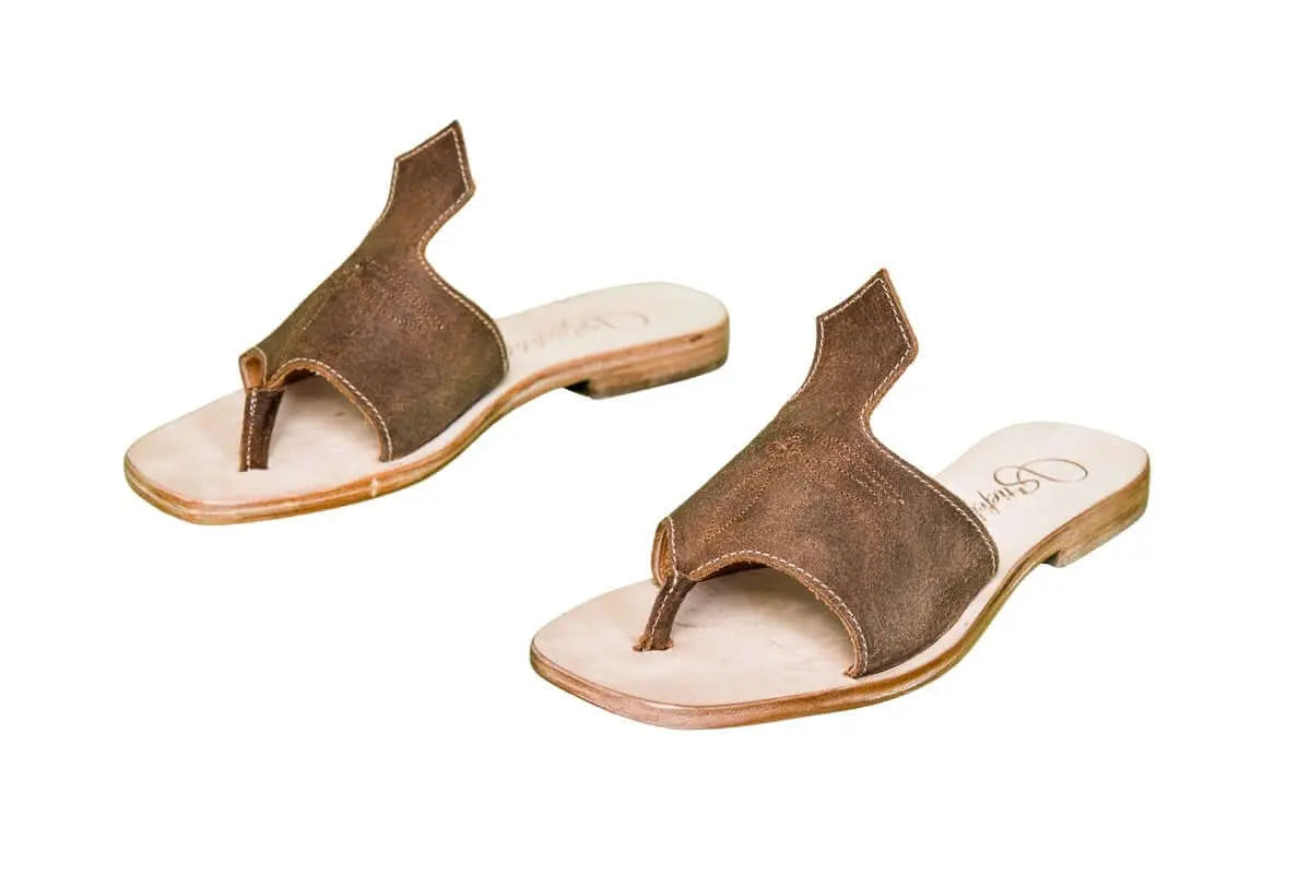Hair-on hide and leather flip flop sandals perfect for sunny days. Western footwear