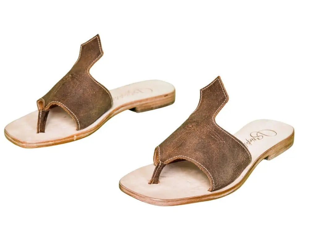 Hair-on hide and leather flip flop sandals perfect for sunny days. Western footwear