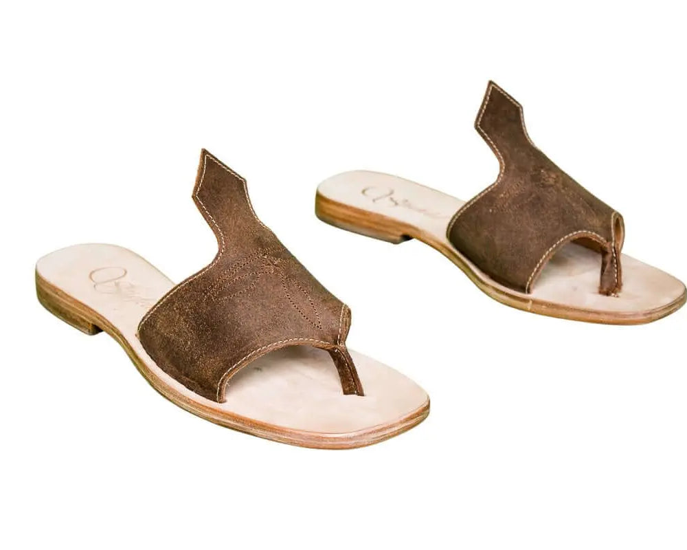 Hair-on hide and leather flip flop sandals perfect for sunny days. Western footwear