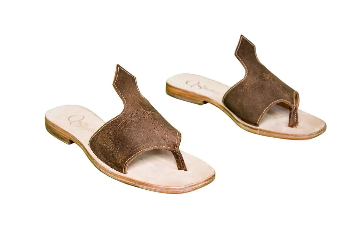 Hair-on hide and leather flip flop sandals perfect for sunny days. Western footwear