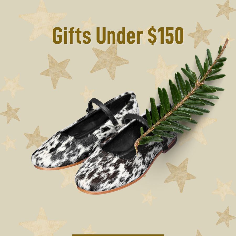 Black and white patterned shoes with a green leaf on a beige background with star decorations and 'Shop Now' button.