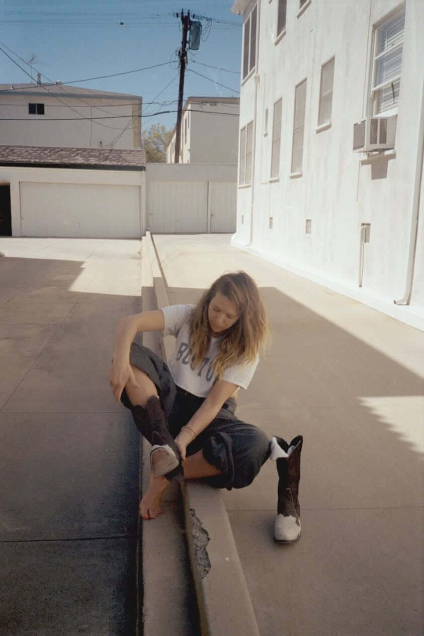 woman wearing cowboy boots carmen in the streets